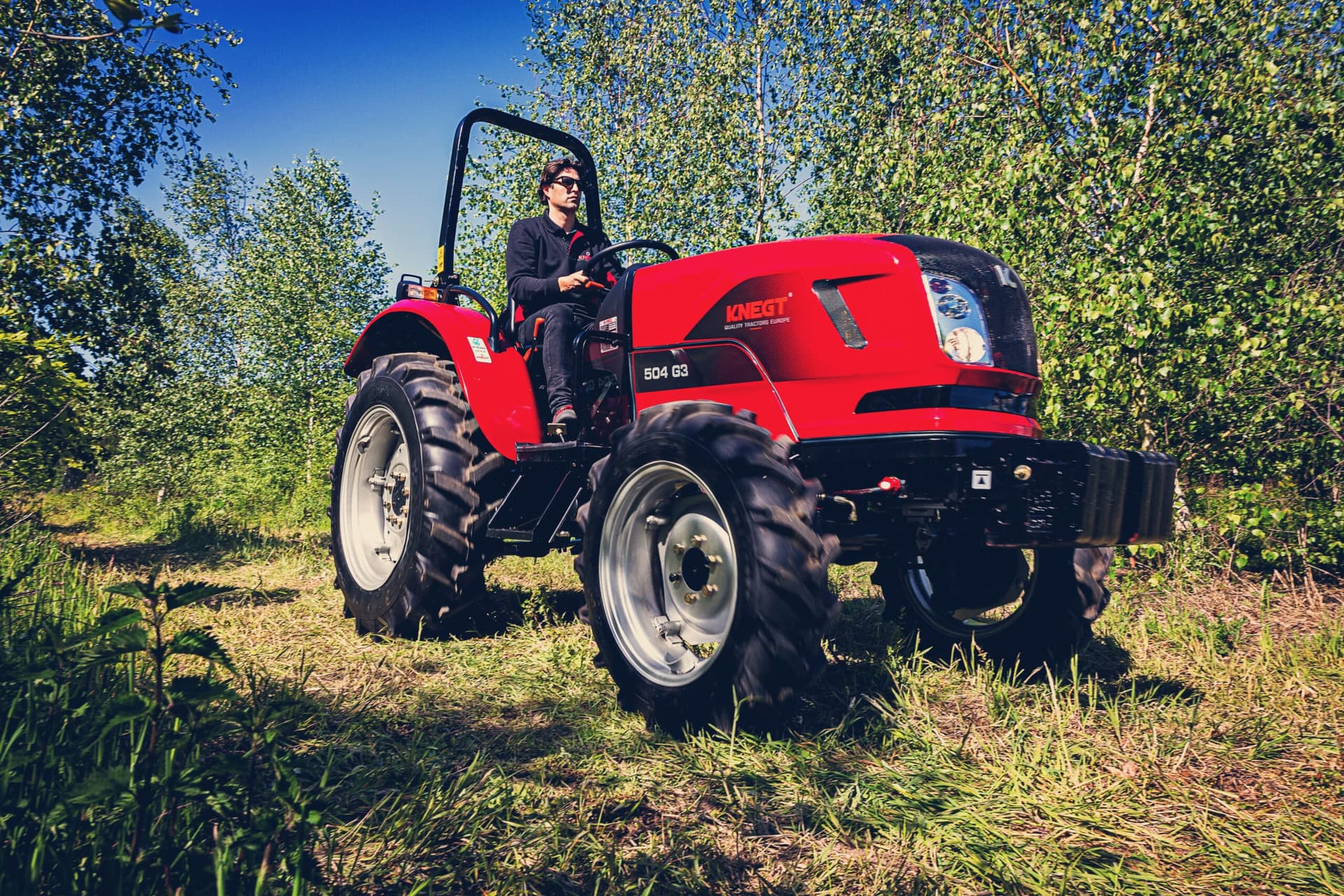 Compact diesel tractor in the field